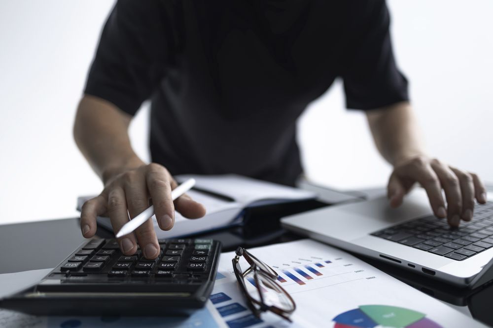 Businessman Analyzing Financial Data and Reports