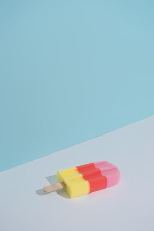 Colorful ice cream popsicle on pastel blue background