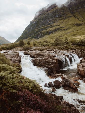 Mountain river with stones on daytime