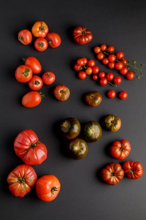 from above view of tomatoes on a dark surface