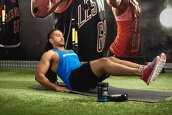 Man doing ab work-out on mat