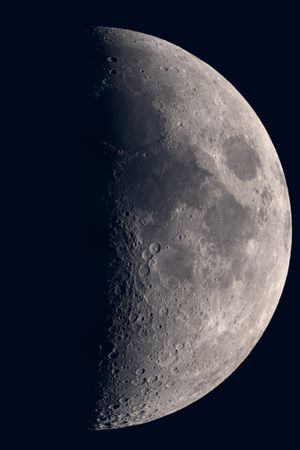 Detailed view of waxing gibbous moon showing cratered surface.