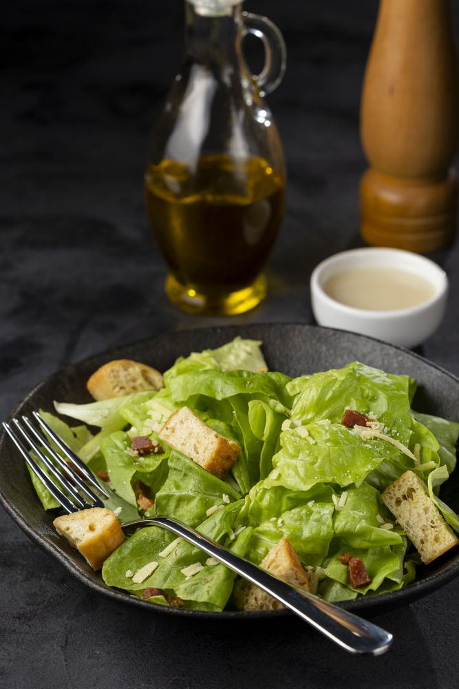Caesar salad with croutons and bacon.