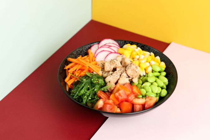 Close Up Hawaiian Poke Bowl on Colorful Background