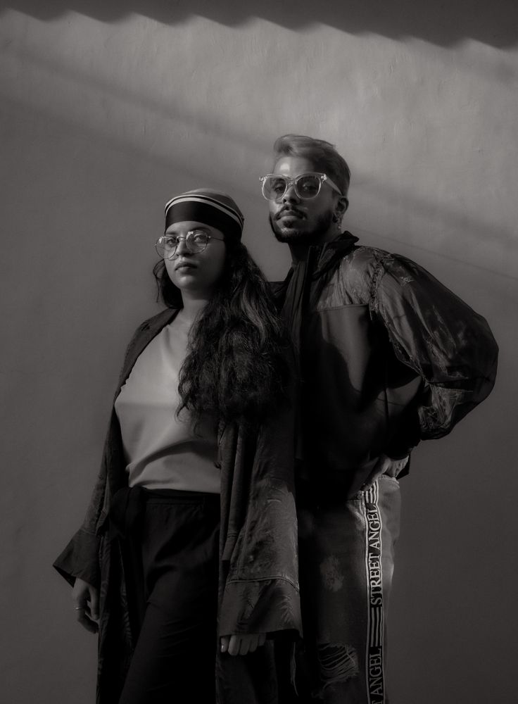 Man and woman in casual wearing standing in grayscale