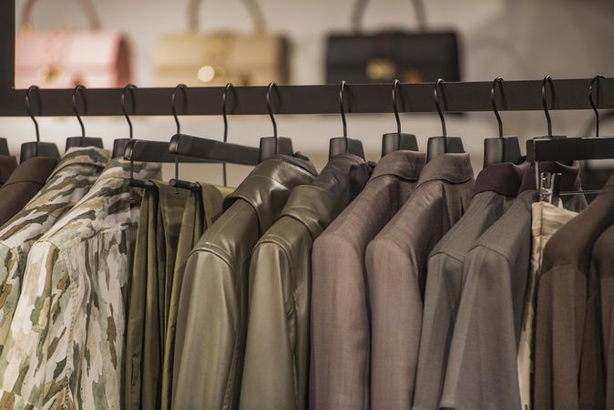 Clothes rack of jackets and pants in fashion store