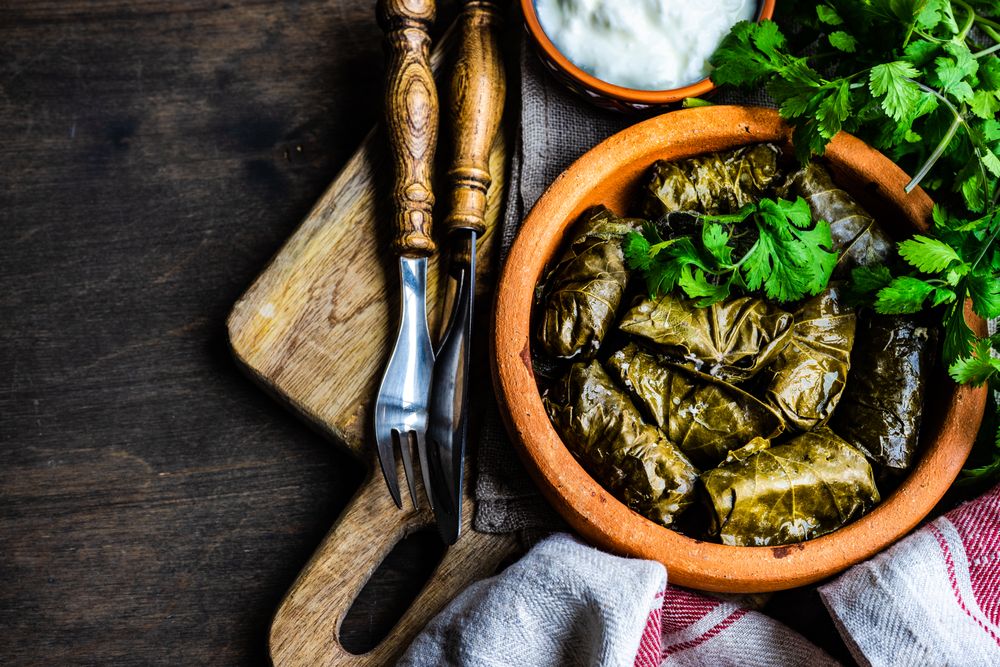 Top view of traditional Georgian dolma dish on wooden board