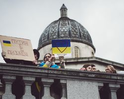 London, England, United Kingdom - March 5 2022: Row of people looking down at protest