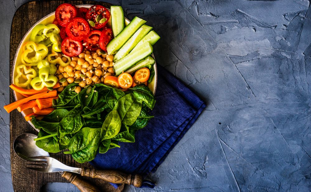 Top view of fresh Buddha bowl lunch with copy space