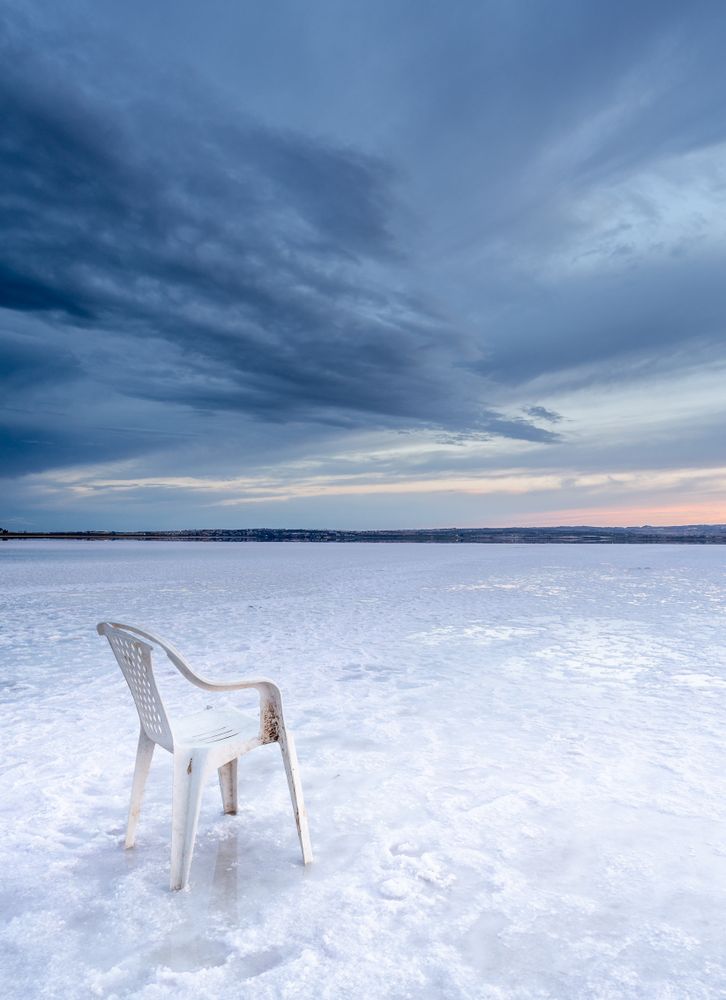 Chair on salt mine during sunset