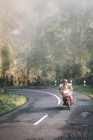 Man riding a motorbike on the road