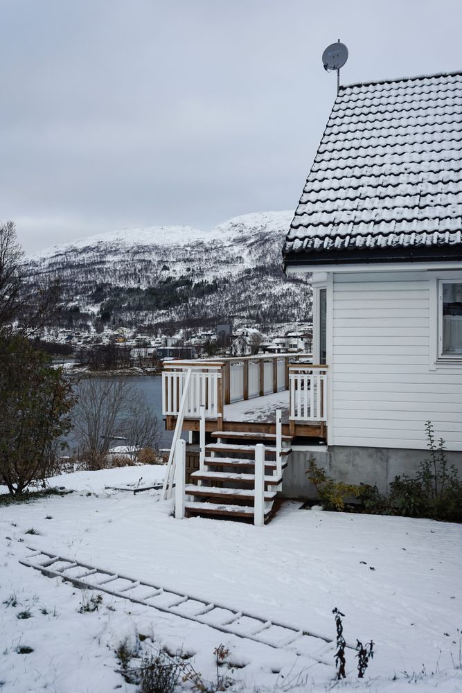 Small country house on lake in winter