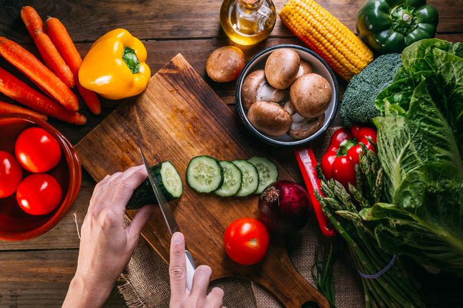 Vegetables and utensils on kitchen table