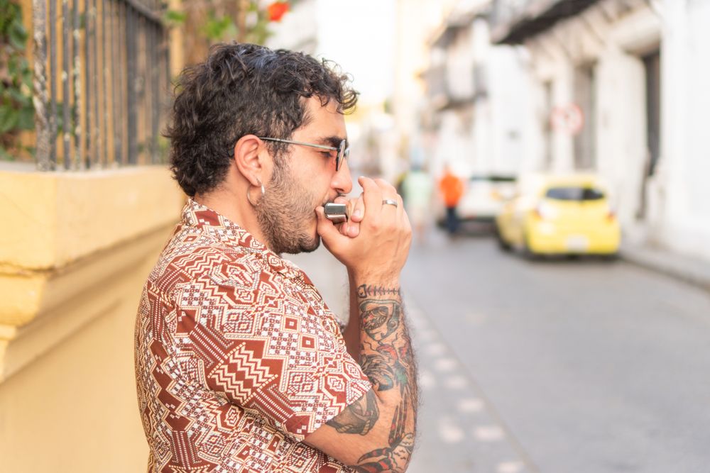 Portrait of Street Musician playing the harmonica