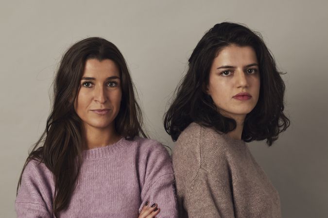 Confident female friends in studio