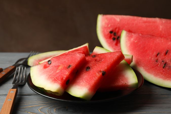 Composition with watermelon slices on gray wooden table. Summer fruit