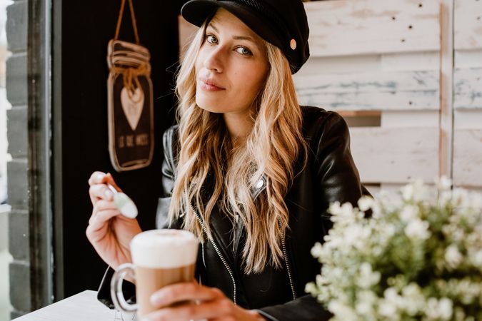 Woman drinking coffee from a glass