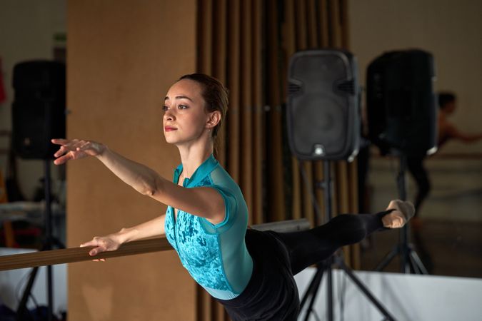 Ballet dancer warming up and dancing at a dance academy
