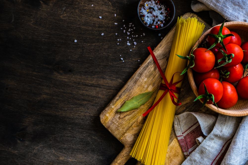 Top view of pasta cooking concept with copy space