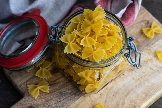 Farfalle pasta in glass jar on kitchen counter