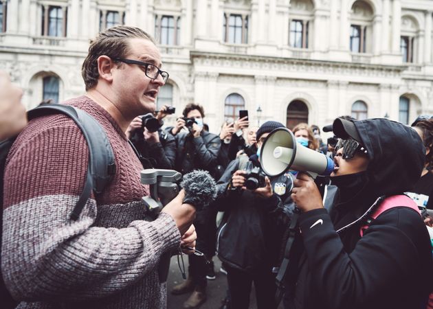 London, England, United Kingdom - June 6th, 2020: Man with microphone and woman with loudspeaker