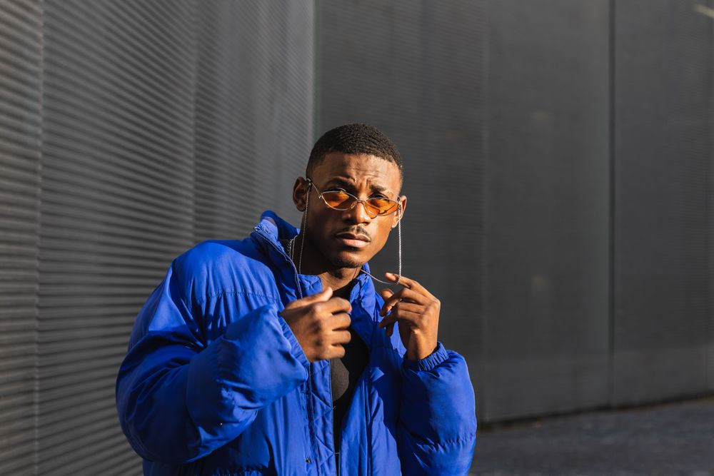 Stylish Black man in sunglasses on street