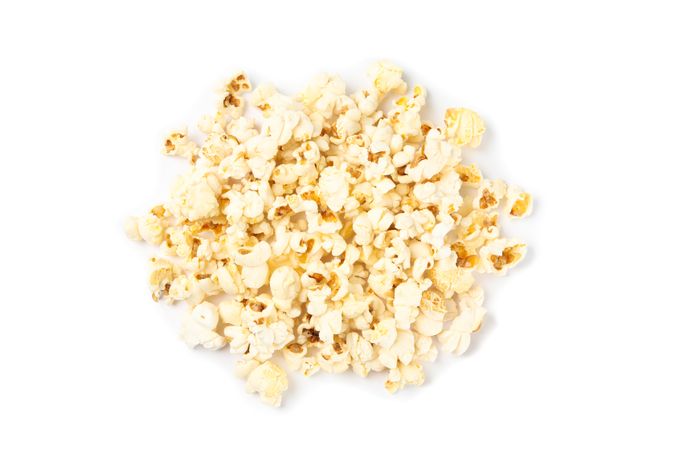 Popcorn pile isolated on blank background, top view