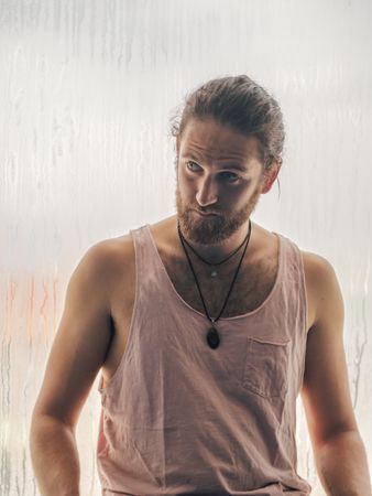 Man in mindfulness on window sill