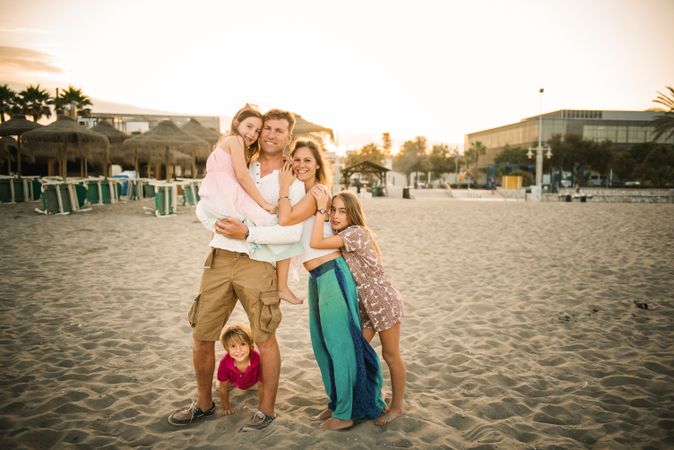 Beautiful happy family with children on beach