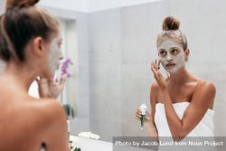 Female with cosmetic mask on face in bathroom 4Oj7a5