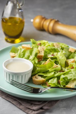 Caesar salad with croutons and bacon.