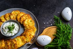 Top view of traditional Ukrainian dish deruny with condiment and salt & pepper