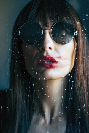 Stylish woman kissing glass