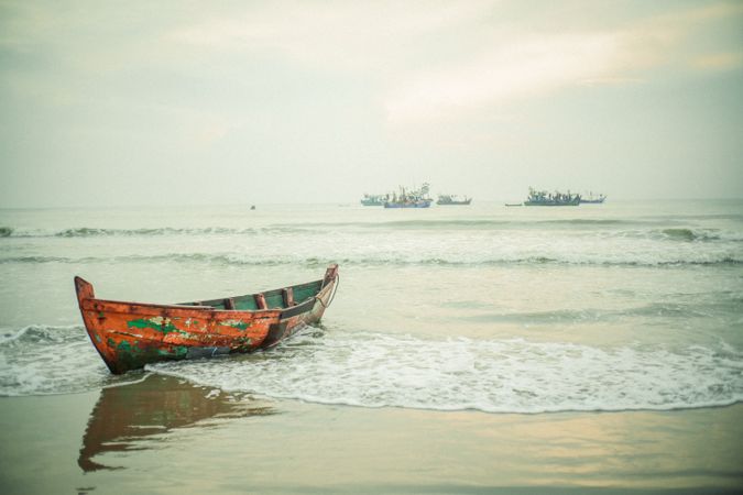 Traditional Solitary Fishing Boat on a Serene Shore