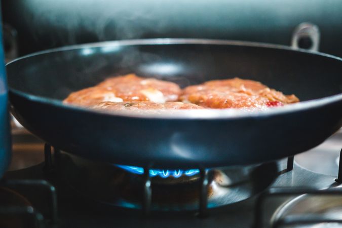 Meat cutlets frying on pan