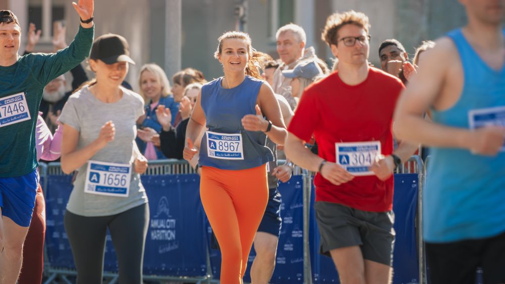 Joggers Giving their Best to Achieve the Finish Line in a Friendly Race