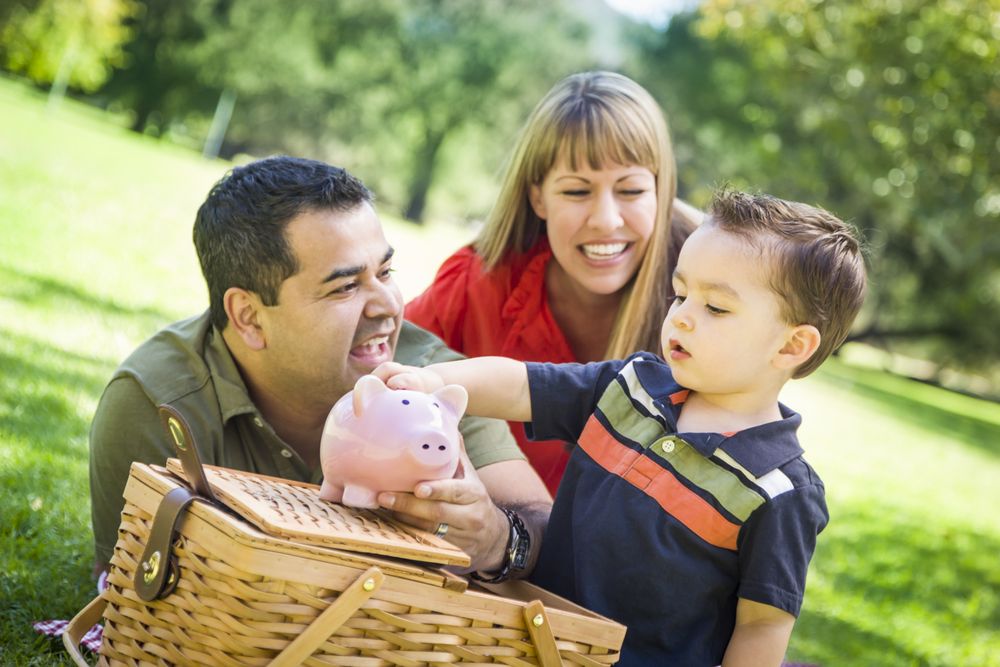 Couple Give Their Son a Piggy Bank at the Park