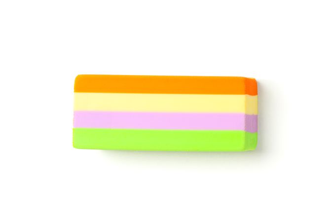 Multicolor eraser isolated on studio background, top view