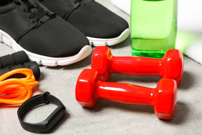 Composition with healthy lifestyle accessories on grey background