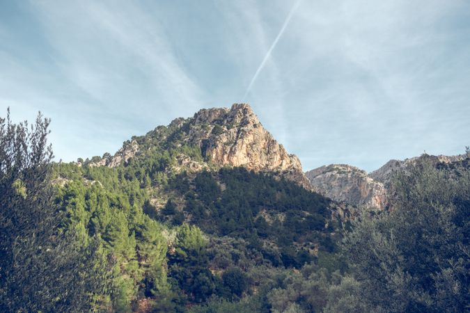 Mountain peak against cloudy sky