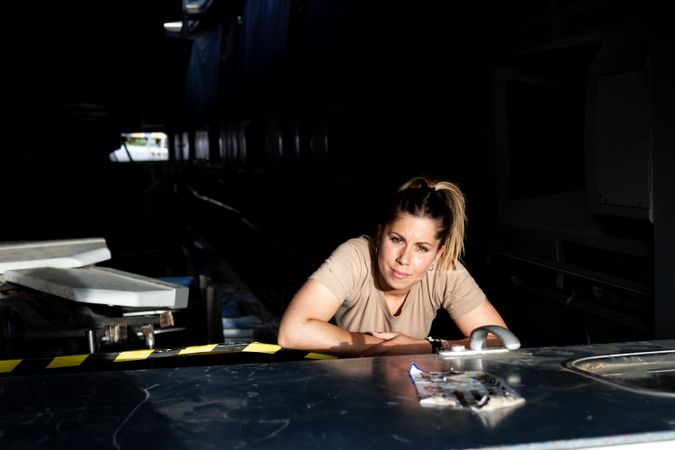 Military woman inside hangar