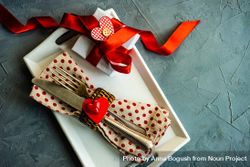 St. Valentine day table setting with dotted napkin wrapped silverware, copy space 5lVVWY