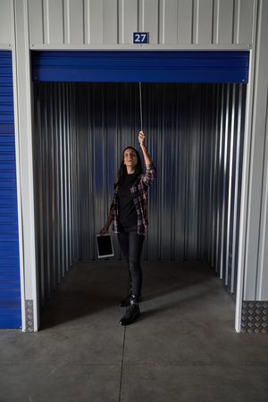 Woman opening metal self storage