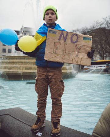 London, England, United Kingdom - March 5 2022: Boy with “No Fly Zone” sign at protest