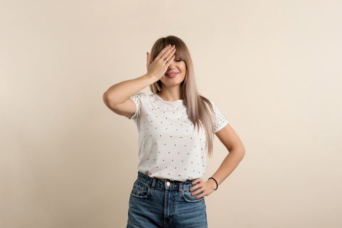 woman posing in pastel background