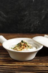 Rice porridge on wooden table