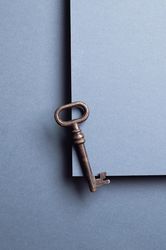 Top view vintage key over gray background