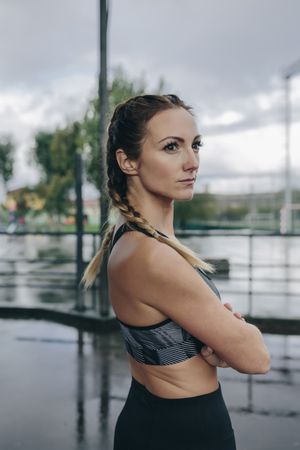 Sportswoman posing arms crossed