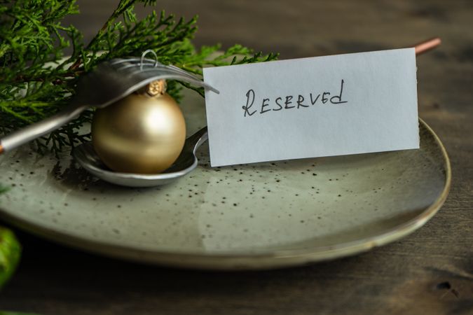 Christmas holiday concept with reserved card on plate