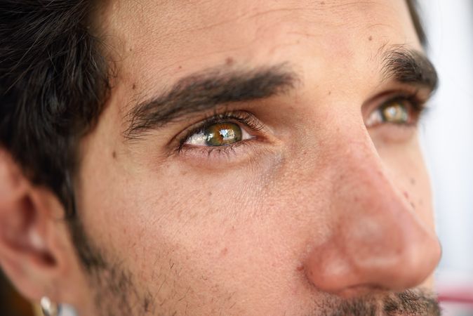 Close up of eyes of dark haired man